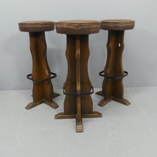 2179 - Three oak and leather upholstered bar stools. Height 77cm.