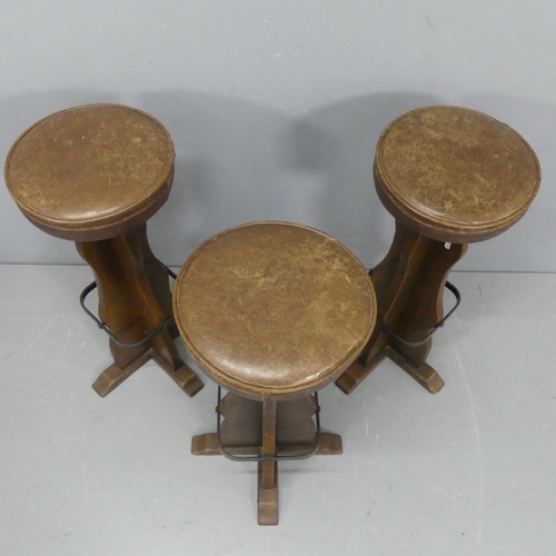 2179 - Three oak and leather upholstered bar stools. Height 77cm.