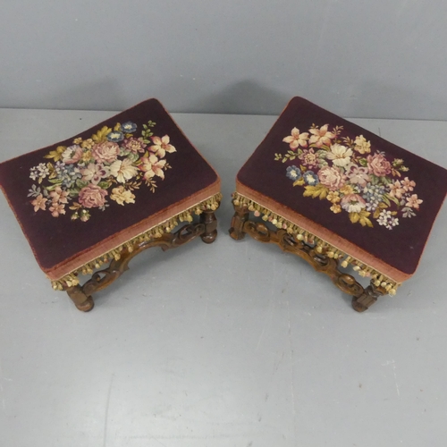 2181 - A pair of Victorian walnut and needlepoint upholstered footstools. Width 53cm, height 41cm, depth 36... 