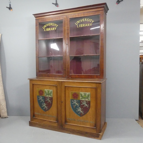 2187 - A Victorian mahogany two section library bookcase, bearing the arms of Pembroke College, Oxford and ... 