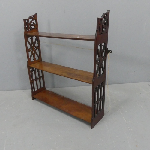 2192 - A Victorian Arts & Crafts mahogany three tier hanging shelf. Width 62cm, height 69cm, depth 16cm.