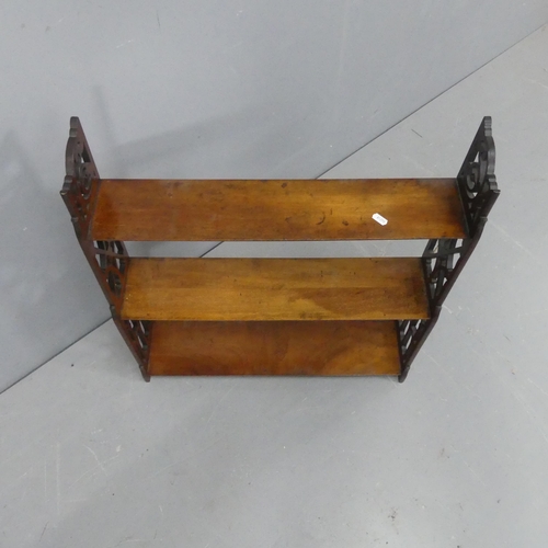 2192 - A Victorian Arts & Crafts mahogany three tier hanging shelf. Width 62cm, height 69cm, depth 16cm.