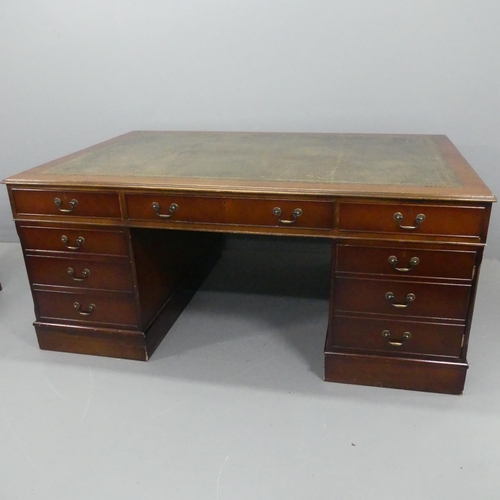 2194 - A reproduction mahogany veneered twin-pedestal partner's desk, with tooled and embossed green leathe... 