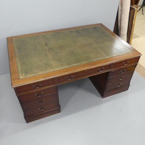 2194 - A reproduction mahogany veneered twin-pedestal partner's desk, with tooled and embossed green leathe... 