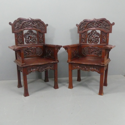 2195 - A pair of red-lacquered Chinese Qing dynasty style throne chairs, with carved and pierced blossom an... 