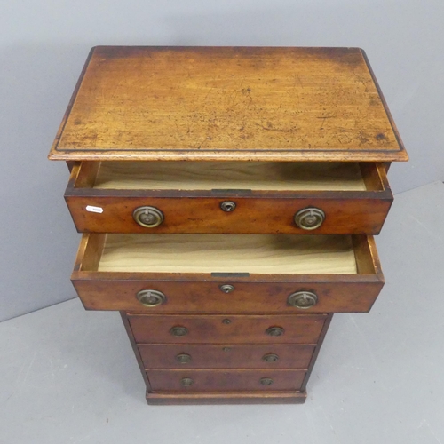 2203 - An antique French mahogany semenier chest of seven drawers. Width 59cm, height 120cm, depth 35cm.