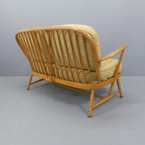 2010 - ERCOL - A mid-century design beech model 204 two-seater sofa, with upholstered cushions and gold mak... 