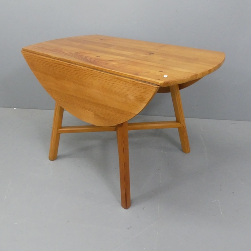 2012 - ERCOL - A Mid-century pine drop-leaf table with blue maker's label. Length 113cm, height 72cm, width... 