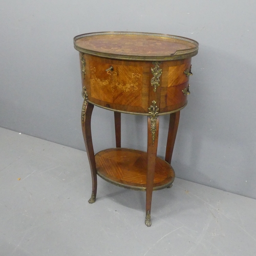 2029 - A French walnut oval two-tier sewing / work table, with pierced brass gallery, lifting lid, single d... 