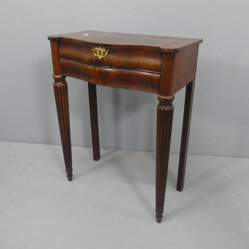 2043 - A French mahogany serpentine console table, with two frieze drawers and raised on fluted tapered leg... 