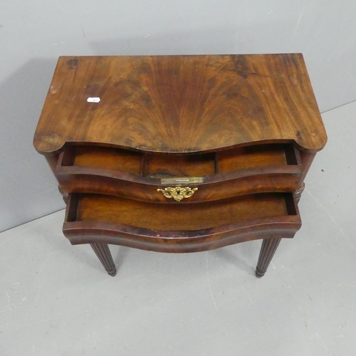 2043 - A French mahogany serpentine console table, with two frieze drawers and raised on fluted tapered leg... 