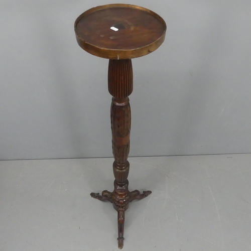 2213 - A 19th century mahogany torchère / plant stand. Height 145cm.