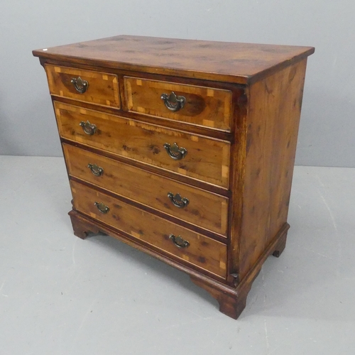 2216 - A cross-banded yew-wood chest of two short and three long drawers, with quarter veneered top and bra... 