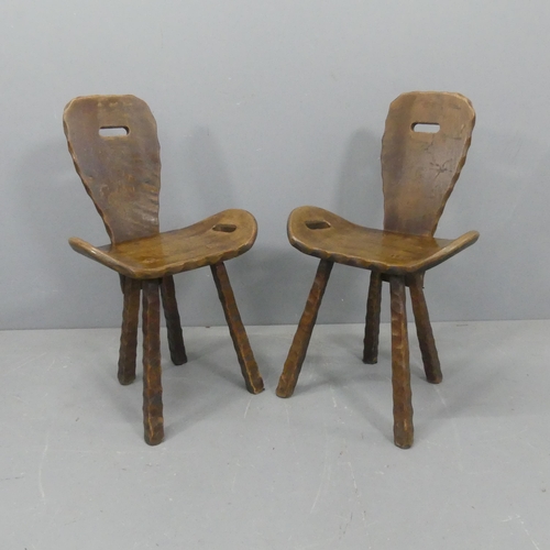 2219 - A pair of mid-century French brutalist chairs, the shaped seats with integral handles.