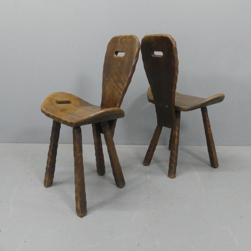 2219 - A pair of mid-century French brutalist chairs, the shaped seats with integral handles.