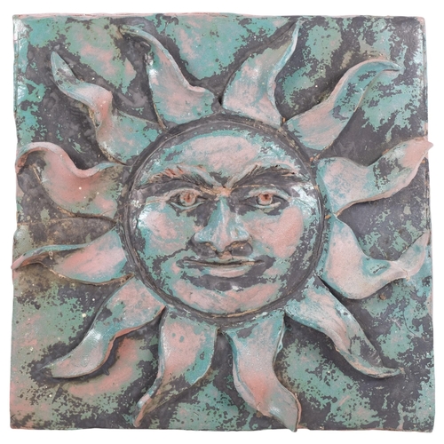 516 - A Vintage terracotta sunburst zodiac style terracotta wall plaque, unsigned, 30cm x 30cm