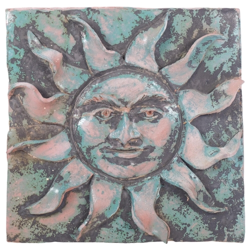 516 - A Vintage terracotta sunburst zodiac style terracotta wall plaque, unsigned, 30cm x 30cm