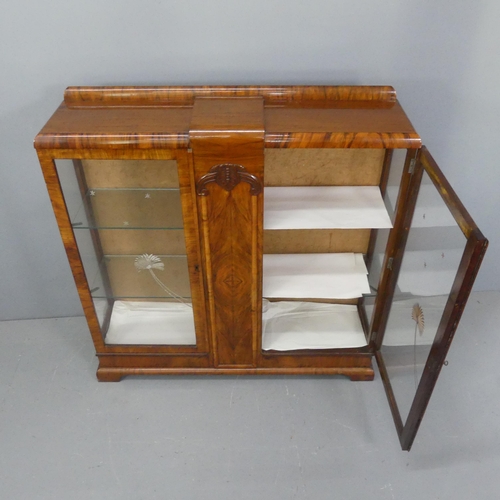 2060 - An Art Deco walnut display cabinet, with two glazed panelled doors with etched decoration and two gl... 