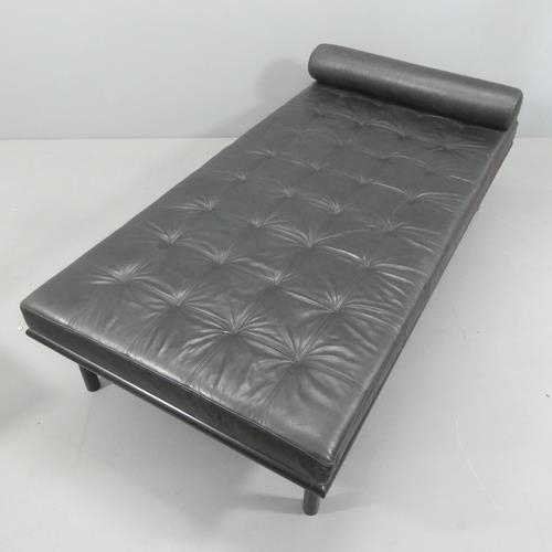 2068 - A contemporary black leather upholstered daybed on metal frame, in the manner of Jean Prouvé. Length... 