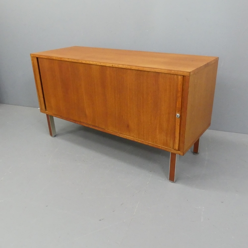 2069 - A mid-century teak sideboard with tambour sliding front, and shelf fitted interior, in the manner of... 