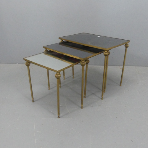 2074 - A set of 3 nesting brass tables, with inset mirrored tops, in thr manner of Maison Jansen. Largest W... 