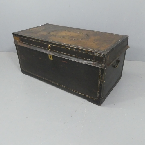 2083 - A 19th century studded leather covered camphor wood trunk with brass mounts. Width 105cm, height 49c... 