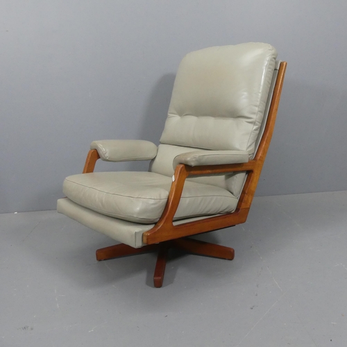 2088 - A mid-century Danish teak and faux-leather upholstered swivel lounge chair.