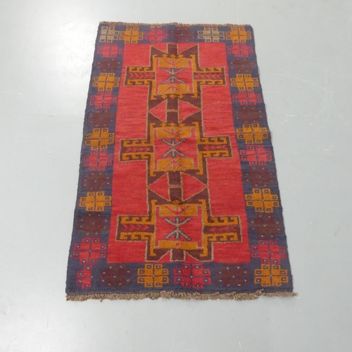 2258 - A red-ground Baluchi rug. Length 134cm, width 81cm.