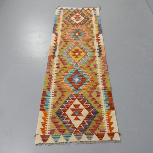 2263 - A Chobi Kilim runner. Length 198cm, width 64cm.