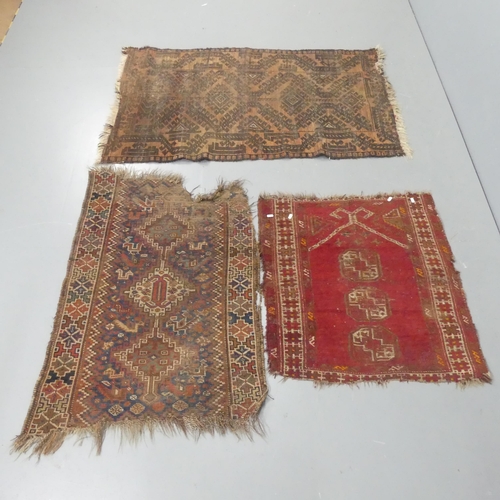 2268 - A red-ground Turkomen rug, another and a Persian prayer rug. (3). Largest length 145cm, width 90cm.