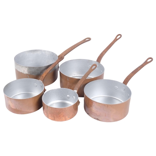 419 - A graduated set of 4 copper saucepans with steel handles, largest 18.5cm, and another similar saucep... 