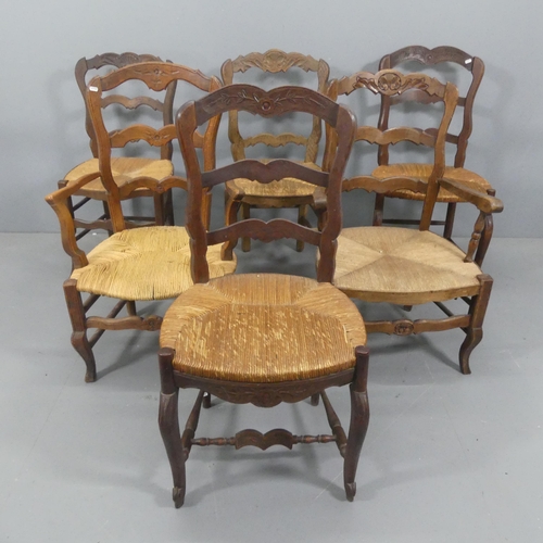 2245 - A matched set of French oak rush-seated ladder-back dining chairs. (4+2).