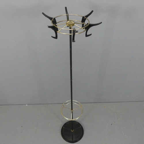 2247 - A mid-century tubular metal hat and coat stand on cast iron base with rotating top. Height 161cm.