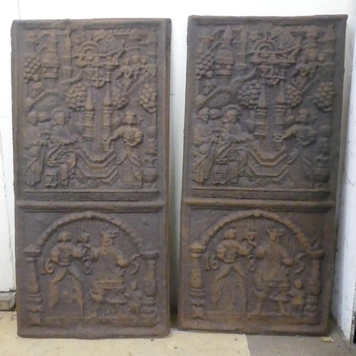 2255 - A pair of antique cast iron panels, with figural decoration and marked 1685. Width 40cm, height 80cm... 