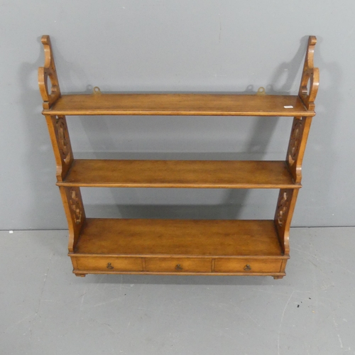 2256 - A 19th century style magoany three tier hanging shelf, with pieced decoration and three drawers. Wid... 