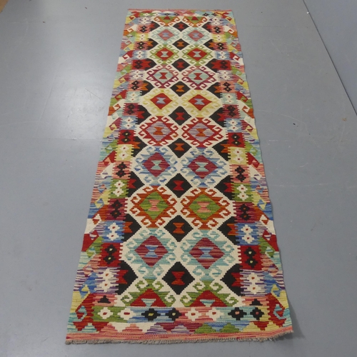 2260 - A Chobi Kilim runner. Length 253cm, width 84cm