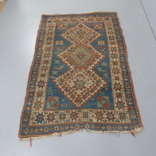 2274 - A cream and blue-ground Kazak rug. Length 200cm, width 125cm.