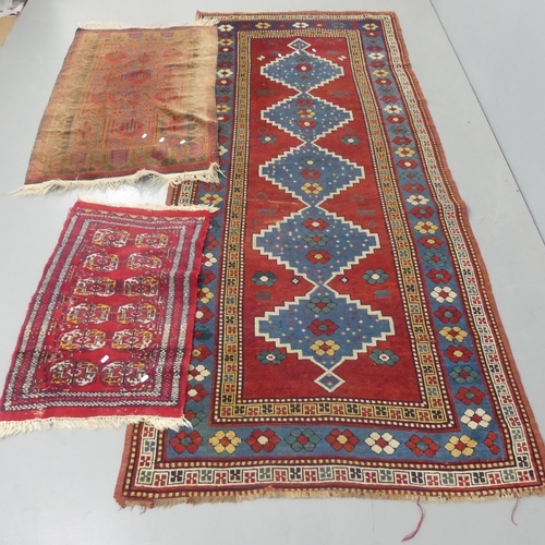 2277 - A red-ground Kilim runner, length 280cm, width 120cm, a Persian rug and an Afghan mat. (3)