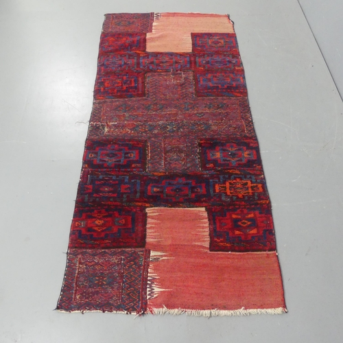 2280 - A Middle-Eastern patchwork rug, possibly rewoven from saddlebags. Length 202cm, width 92cm.