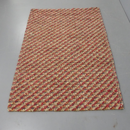 2282 - A modern woven and tufted multi-coloured wool rug. length 180cm, width 29cm