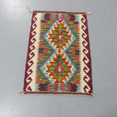 2290 - A Chobi Kilim mat. Length 87cm, width 63cm.