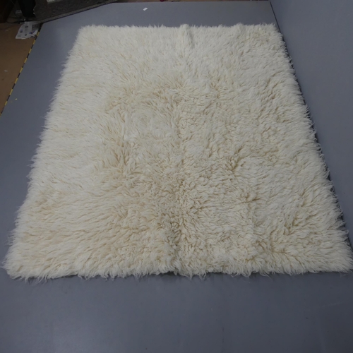 2293 - LIGNE ROSET - A contemporary Chali Flokati rug. Length 260cm, width 195cm.