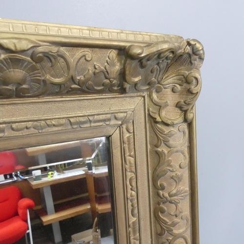 2295 - A 19th century French rectangular gilt gesso framed and bevel edged wall mirror. Width 98cm, height ... 