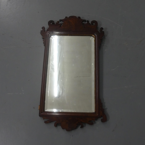 2300 - A Georgian mahogany framed wall mirror. Width 43cm, height 78cm.