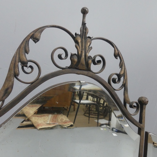 2301 - A French three-fold dressing table mirror in wrought iron frame with two candle sconces. Maximum dim... 