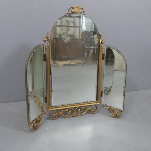 2302 - A French three fold dressing table mirror in carved giltwood frame. Maximum dimensions - width 69cm,... 