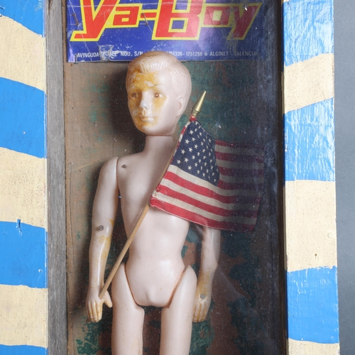 116 - Curiosity/Macabre: Peter Quinnell - 'Ya-Boy' a modern abstract diorama, a doll holding an American f... 