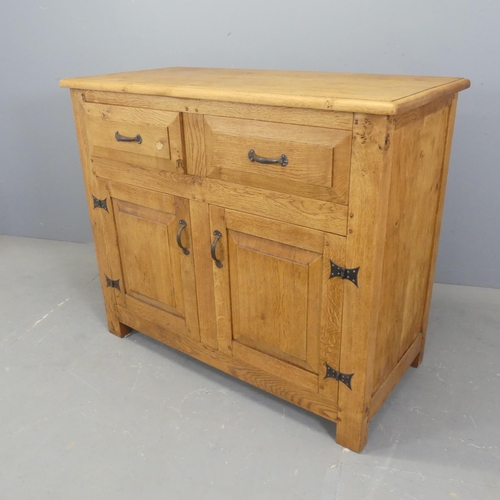 2514 - A modern light oak sideboard, with two drawers above two fielded panelled doors. Width 107cm, height... 