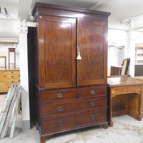 2518 - A 19th century mahogany three-section linen press, with slide fitted interior and two short and two ... 