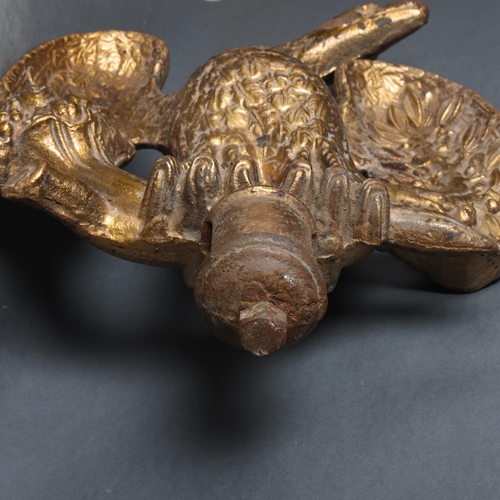 639 - A large cast gilded metal eagle pediment, height 54cm.